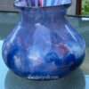 a blue and white vase on a table