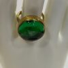 Adjustable green brass ring