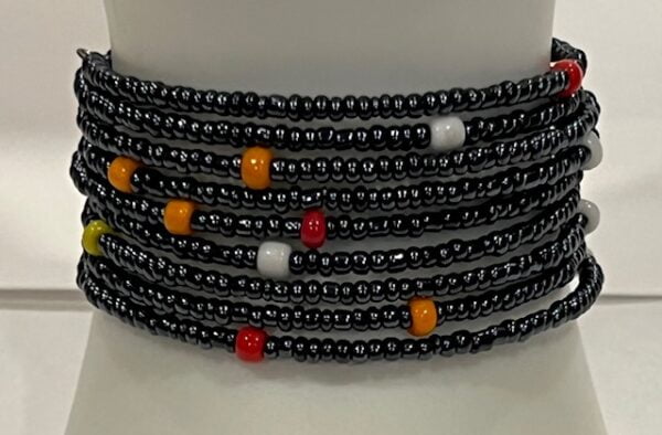 Adjustable black, white and orange beaded bracelet